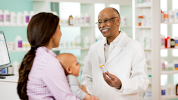 Mother and baby pick up prescription from pharmacy.
stevecoleimages/E+ via Getty Images

