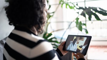 Telehealth: woman on telehealth call 1346877020