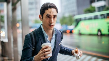 diet nutrition: man walking with coffee and dessert 1157727550