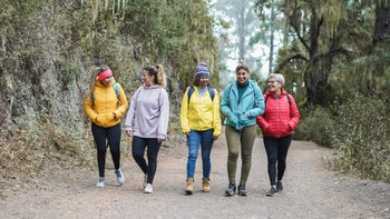Menopause: Perimenopause symptoms: multiracial middle aged friends hiking-1368376265