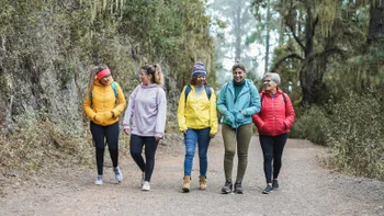 Menopause: Perimenopause symptoms: multiracial middle aged friends hiking-1368376265