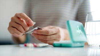 crohns-disease: closeup pill organizer 2158928429