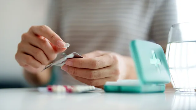 crohns-disease: closeup pill organizer 2158928429