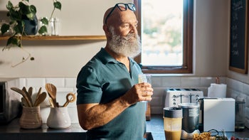 Senior health: senior man drinking protein shake 1407671917