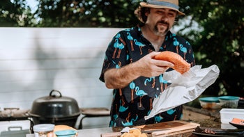 Health: Diet and nutrition: man preparing raw salmon 1254483473