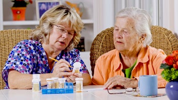 Medication education: hcp senior patient going through medications 182789562