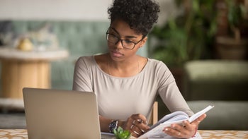 Healthy mind: Concentration: woman focused doing work GettyImages 1144287280