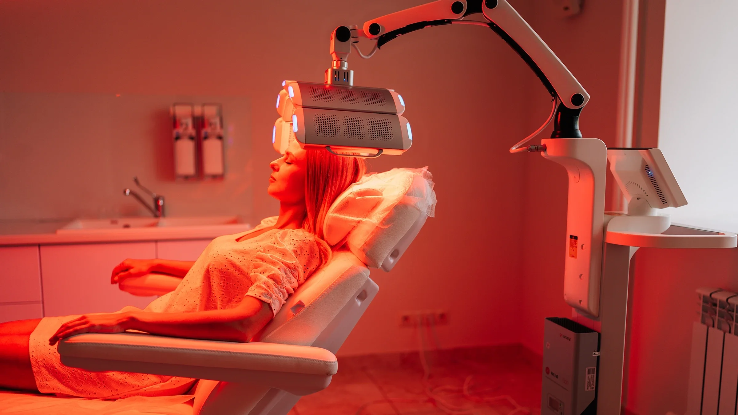 A woman undergoes red light therapy.