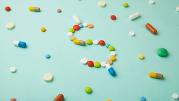 scattered-pills-dollar-sign-940992584