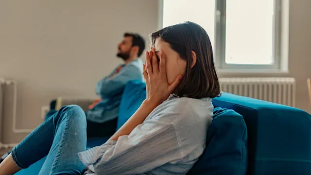 mental-health: couple issues separate ends of couch-1144130467