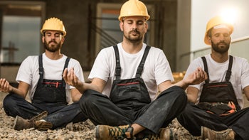 Mental health: Men: construction workers meditating 1129347214