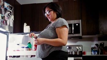Weight Loss: woman prepping stomach injection 1304848611