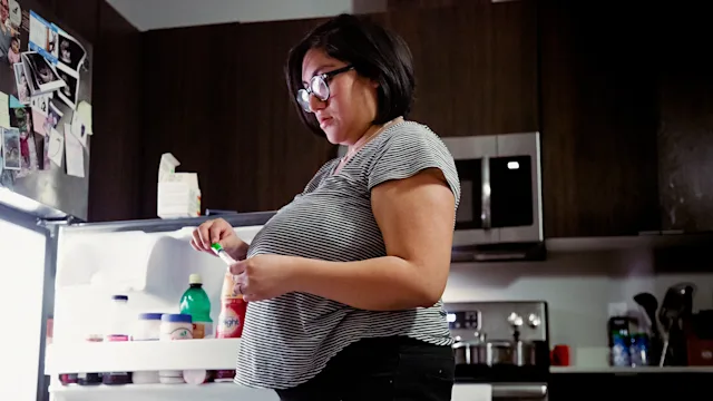 Weight Loss: woman prepping stomach injection 1304848611