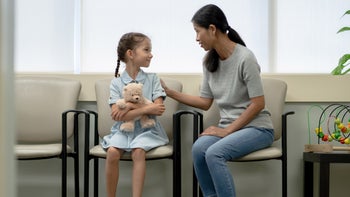 Vaccines: waiting room parent child teddy bear 1354775650
