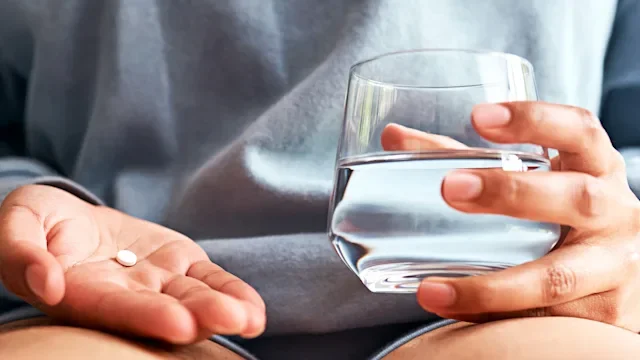Medication Education: closeup oral medication and water 2148819071