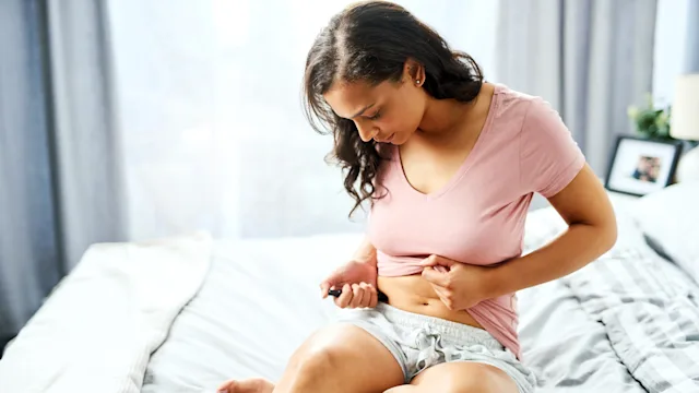Diabetes: woman injection in side 1156718067