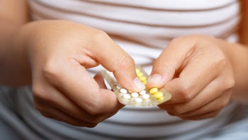 Hypertension: closeup woman birth control pills 1038972222