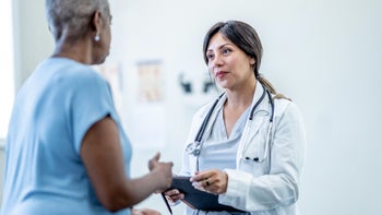 myasthenia gravis: healthcare professional speaking to patient 2030190156