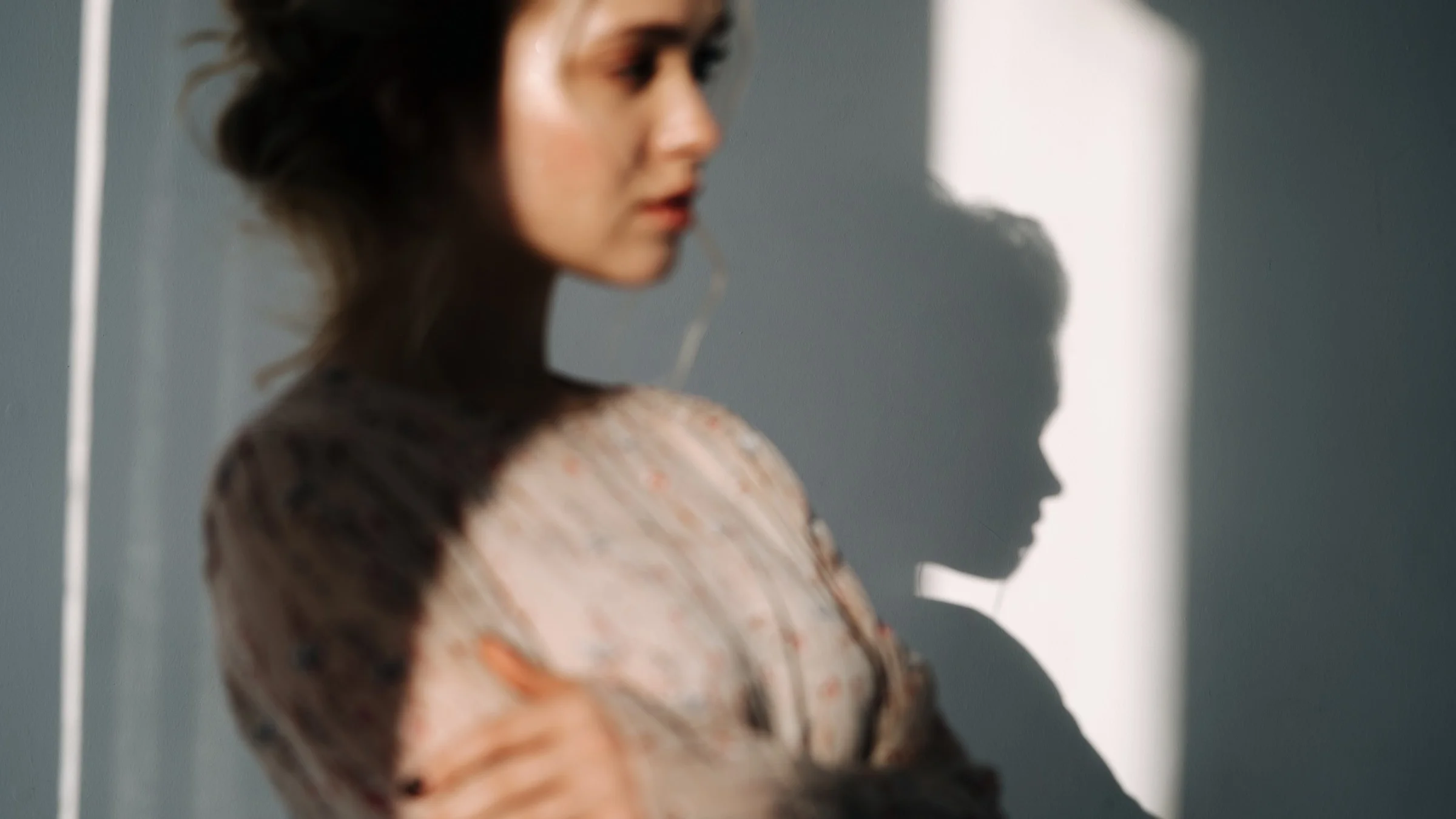 A blurred portrait of a stressed out person.