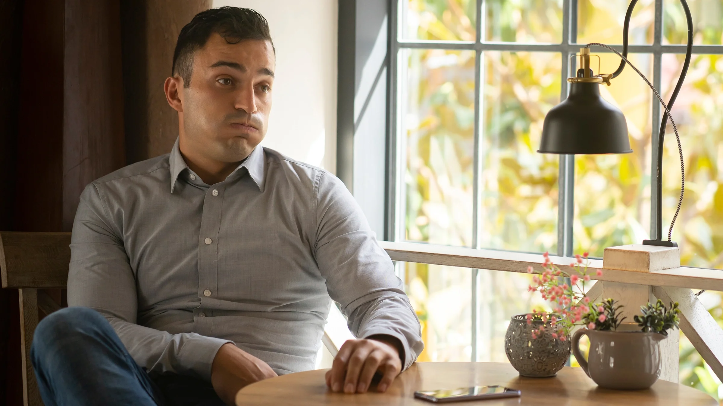 Man stressed while sitting at a restaurant