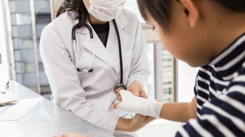 musculoskeletal-conditions: bruised bone bandaged child doctor-533777571