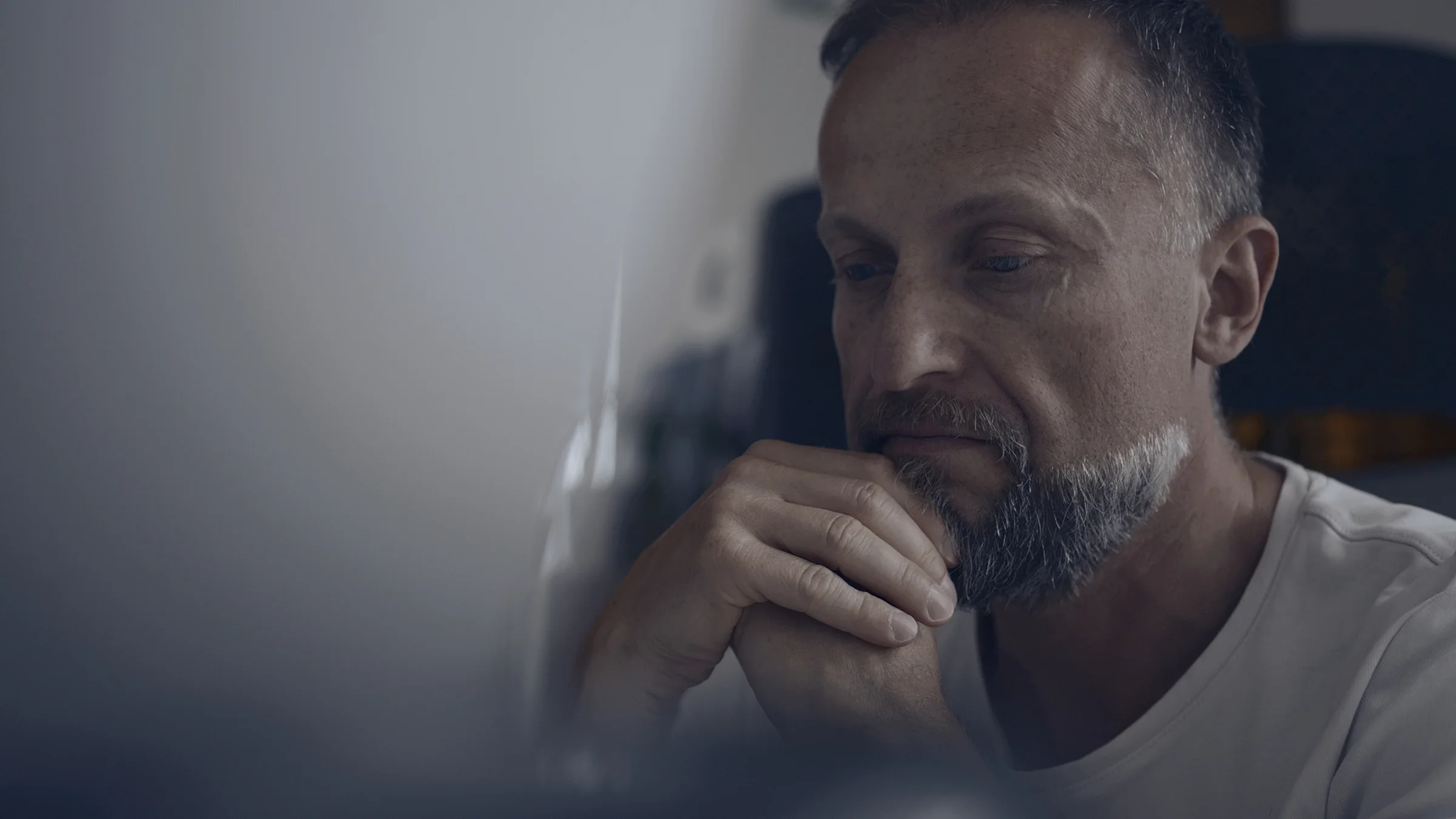 Man sitting alone in a room and looking for comfort