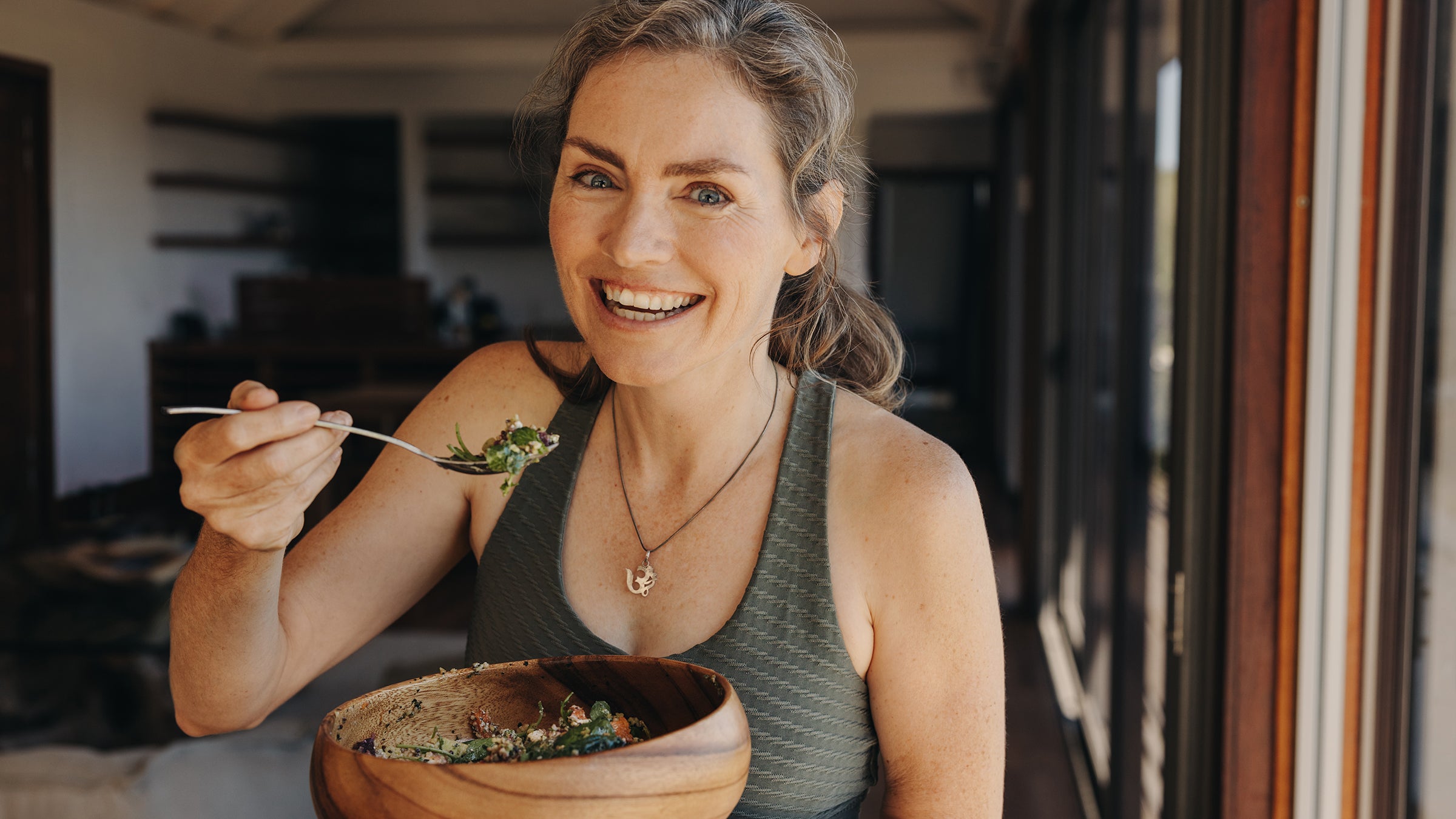Diet Nutrition: woman eating a salad 1438895297