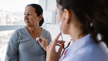 heart: listening to patient heartbeat with stethoscope 1490715888