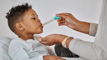 Health: Childrens health: young child getting medicine from dropper-1385404668