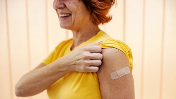 Vaccine: woman after vaccine shot 1941886917