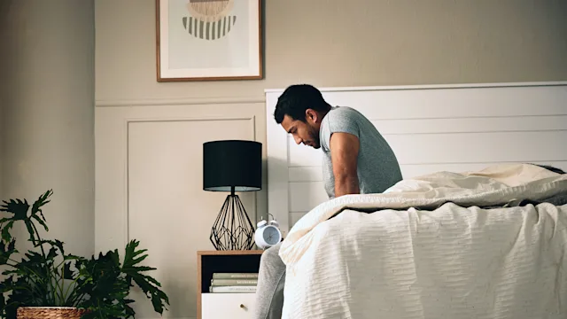 Health: Erectile Dysfunction: upset man sitting on bed 1408385119