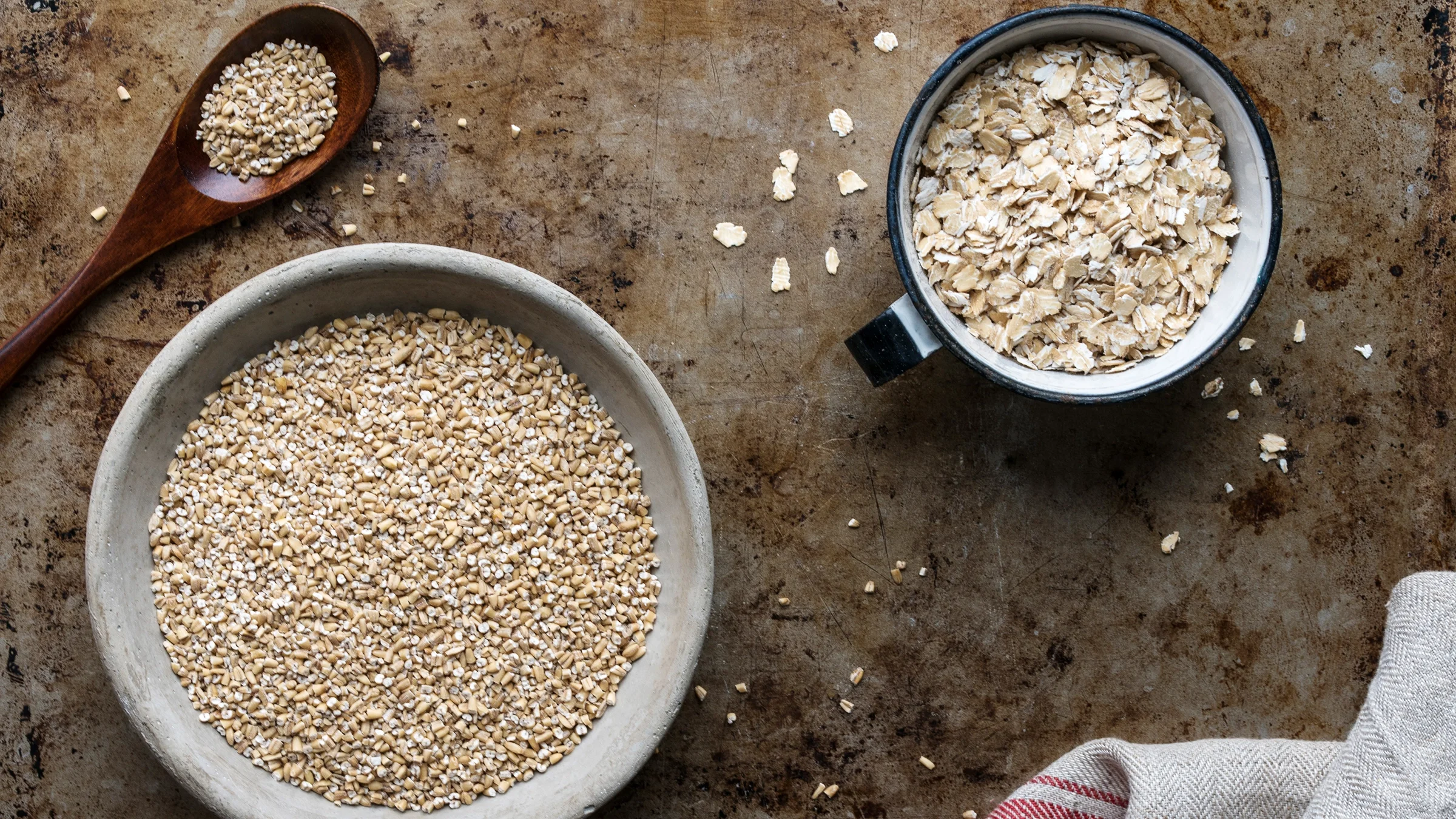 Steel cut and rolled oats on tabletop