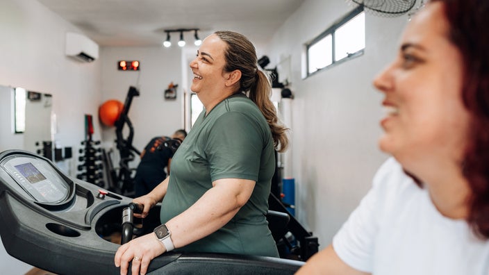 Woman walking on a treadmill