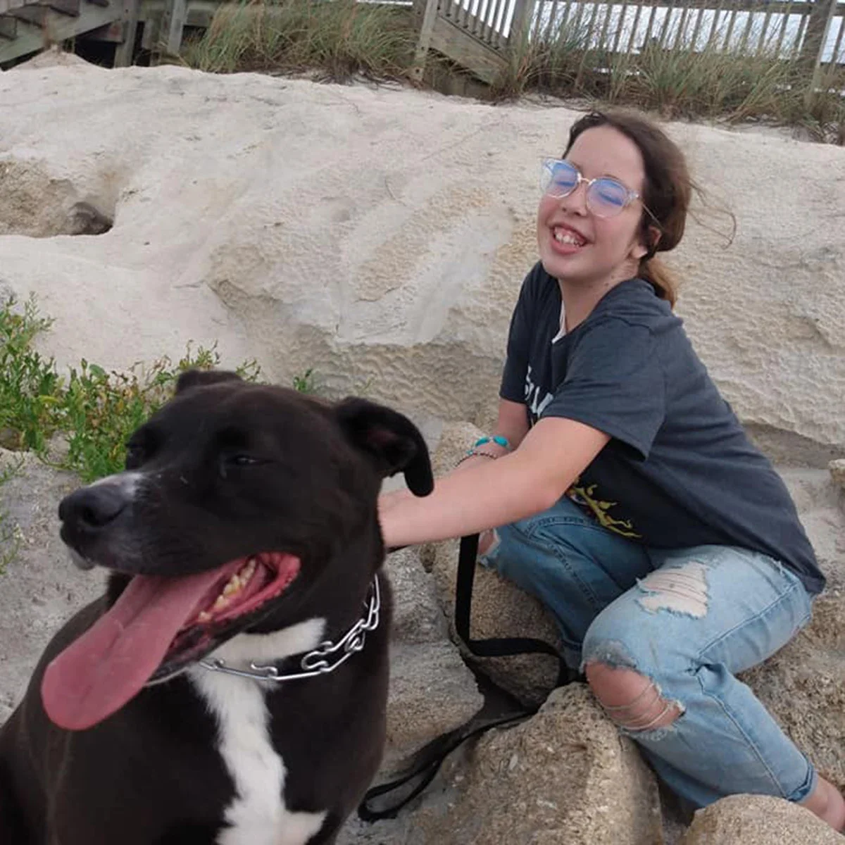 Jennifer Edwards’ daughter Autumn is pictured with their dog Sunday on the beach in Florida.