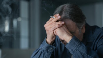 Smoking Cessation: man smoking a cigarette 1455034981