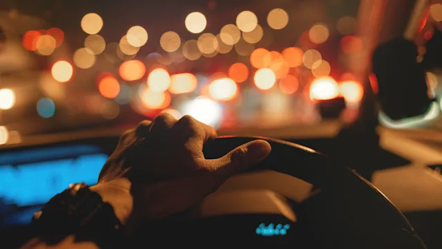 Eye: close up steering wheel nighttime drive GettyImages 1150734773
