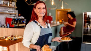 Health: Hepatitis A: portrait woman serving food-1366734451