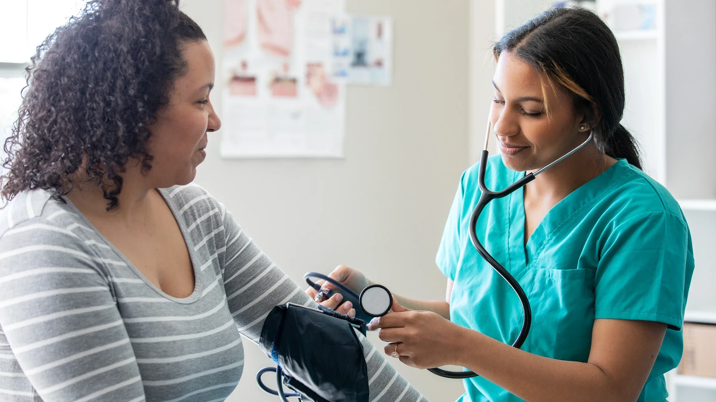 Woman getting blood pressure checked.
Courtney Hale/E+ via Getty Images