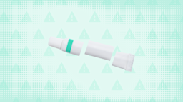 Light teal background with texture and warning sign pattern. In the center is a white and teal ointment tube cut into thirds. 
GoodRx Health