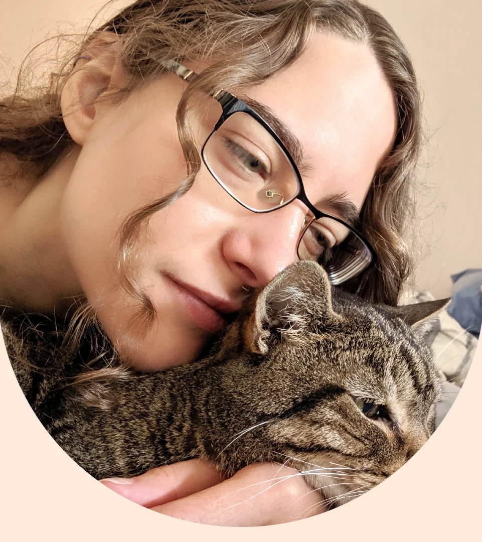 Ari Holmes is pictured in a snapshot with her cat.