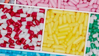 Health: Clindamycin: flat lay colorful pills in boxes-1309890475