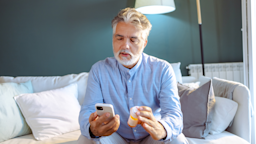 A man looks up information about his medication online.
blackCAT/E+ via Getty Images