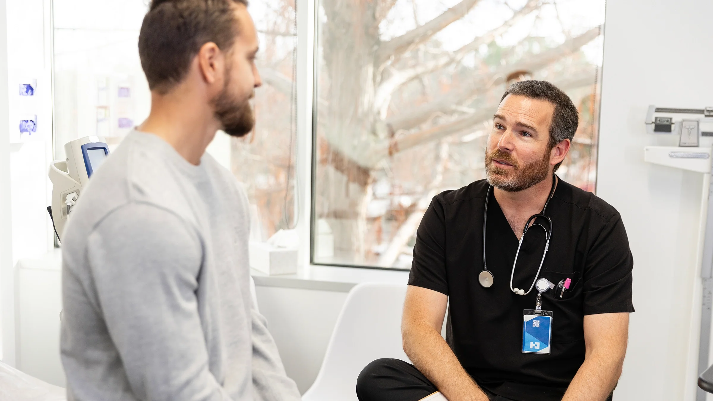 A medical professional speaks to a patient.
