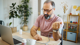 A person measuring their blood pressure in a telehealth call.
mixetto/E+ via Getty Images
