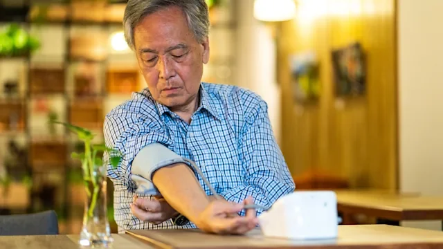 Health: Amlodipine: senior man taking blood pressure 1188400056