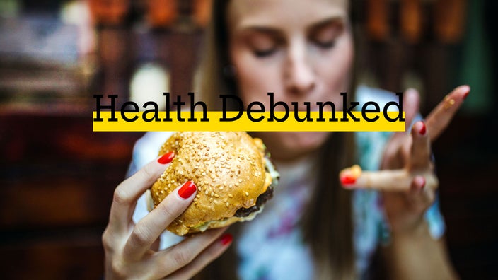 Woman eating a cheeseburger.