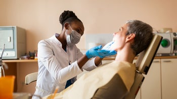 Health: Dental care: dentist working on patient 1304029196