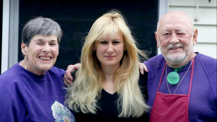 Kim Van Hassel is pictured in a snapshot with her parents.
