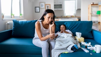 childrens health: mother at home with sick child 1168062994