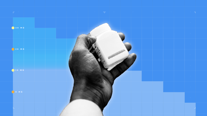 In the center of a blue background with graph paper texture and representational step graph is a black and white cutout of a hand holding a square pill bottle. 